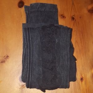 Distressed black jeggings